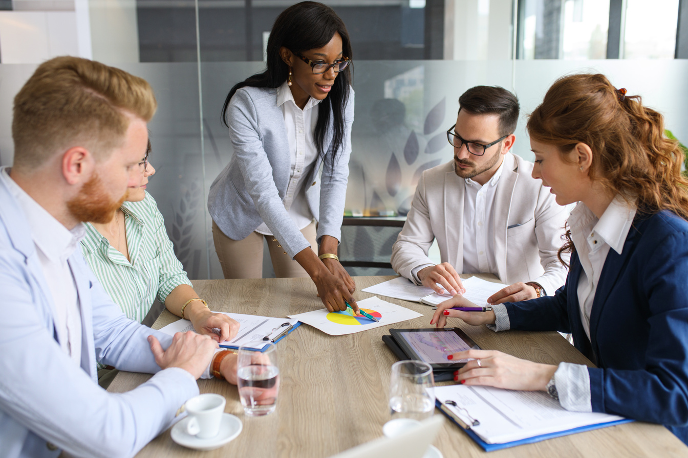 Business people discussing new market and sales analysis